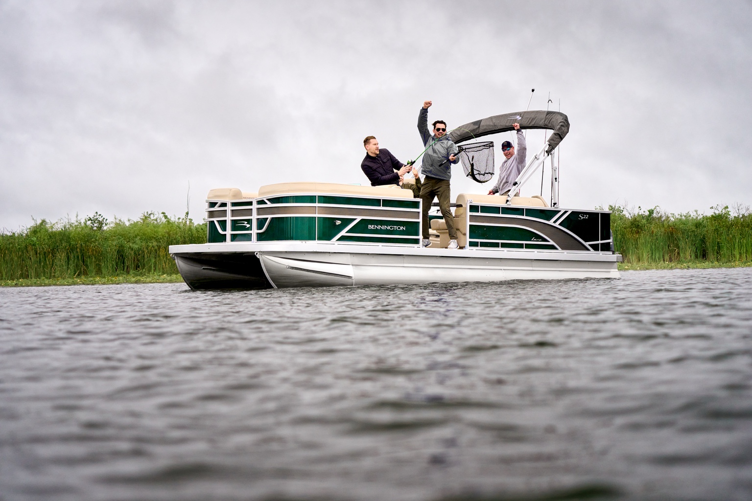 Bennington pontoon fishing on the lake