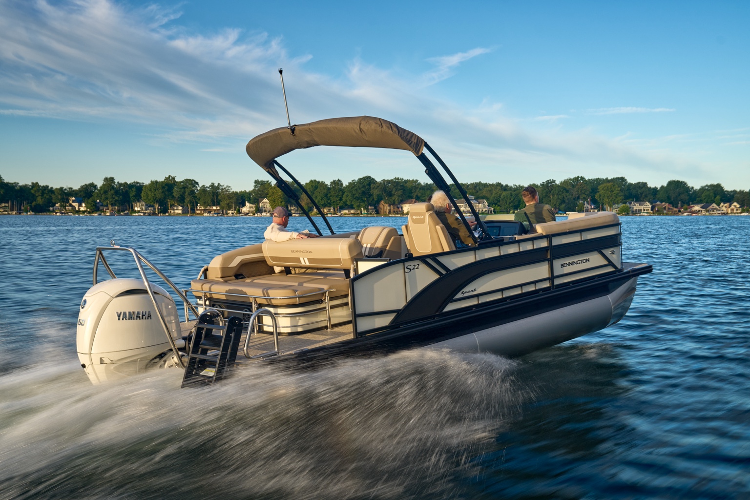 Bennington pontoon cruising across the lake